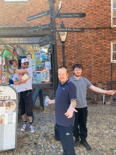 Trainees celebrating route finding by a lampost in Rye